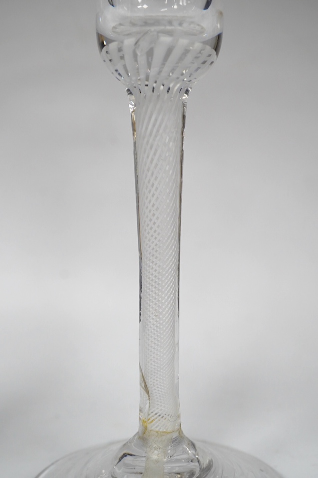 Three DSOT stem drinking glasses, c.1760, tallest 18.5 cm high. Condition - the ale glass - tiny splinter chip to the under edge of base, the wine glass with round funnel - good condition, the wine glass with a bell bowl